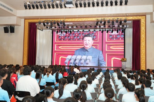 Fostering National Pride: Students and Teachers Watch Military Parade